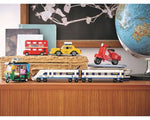 Red LEGO Creator Vespa 40517 model displayed with other LEGO vehicle models: bus, taxi, rickshaw, and train.
