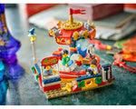 Built LEGO Creator 40714 Carousel Ride set with a red and gold mini-carousel, ticket stand, and three minifigures.