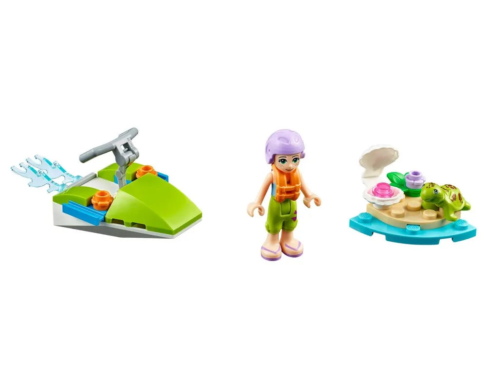 LEGO Friends Mia minifigure, a green jet ski with water splashes, and a small island with a turtle and seashell.