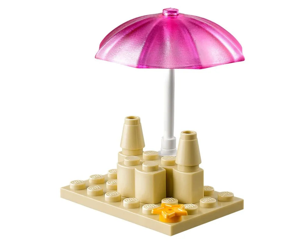 LEGO Friends 41028 mini build featuring a tan sandcastle, a translucent pink beach umbrella, and a yellow starfish.