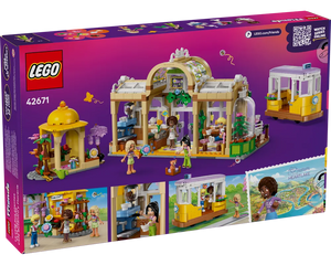 Back of LEGO Friends 42671 Plant Café & Flower Shop box showing assembled set: a large cafe, a gazebo, and a yellow tram.
