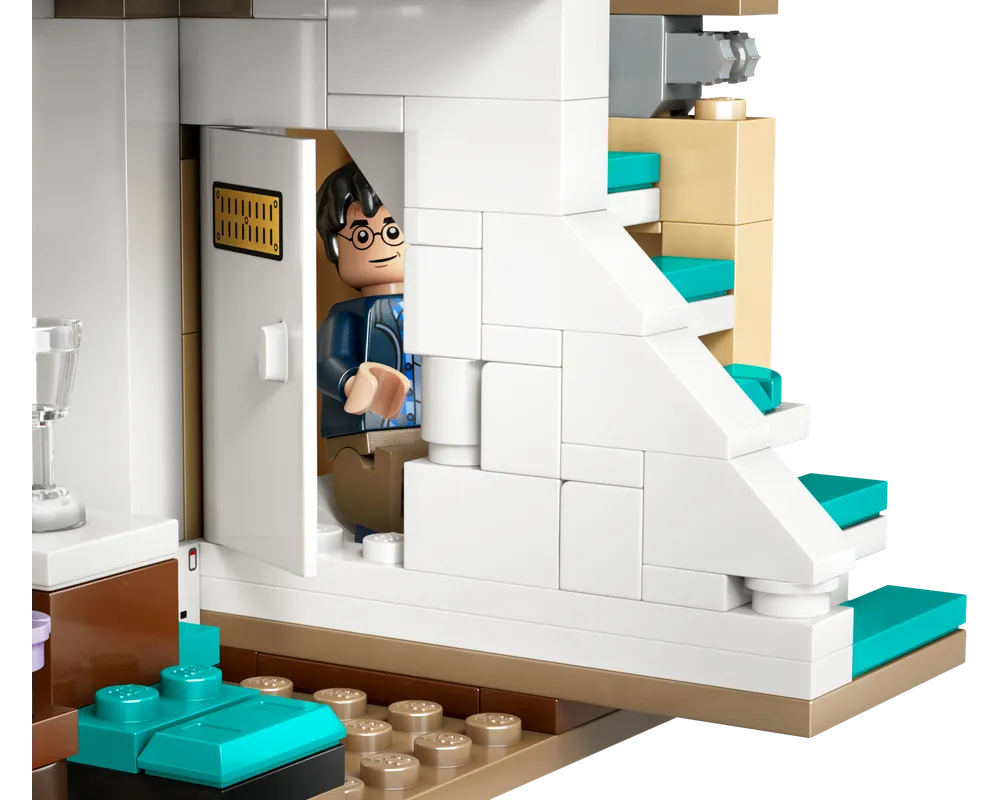 LEGO Harry Potter minifigure peeks from a door in Privet Drive set, featuring a white staircase with teal steps.