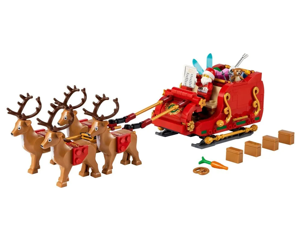 LEGO Santa's Sleigh set with Santa, four reindeer, gifts, a carrot, and a pretzel on a white background.