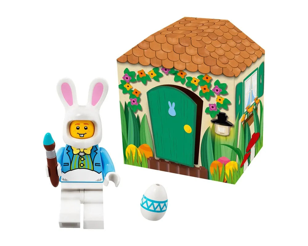 LEGO Iconic Easter 5005249 set: a bunny minifigure with paintbrush, decorated egg, and a charming bunny house backdrop.