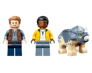 Two LEGO minifigures, one with a brown vest and one with a yellow hoodie, next to a blue and tan baby triceratops.