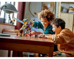 Two boys playing excitedly with the golden, purple, and blue LEGO Ninjago Arc Dragon of Focus (71836) and minifigures.
