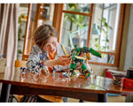 Child playing with LEGO NINJAGO 71845 Lloyd’s Jet Mech, holding the green and gold robot on a wooden table.