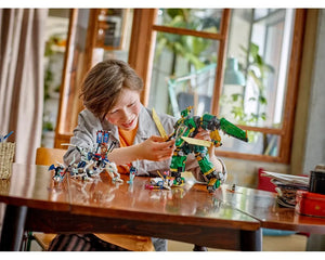 Child playing with LEGO NINJAGO 71845 Lloyd’s Jet Mech, holding the green and gold robot on a wooden table.