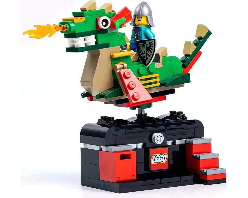 A green LEGO dragon with a knight minifigure on its back, spewing fire, displayed on a black and red LEGO base.