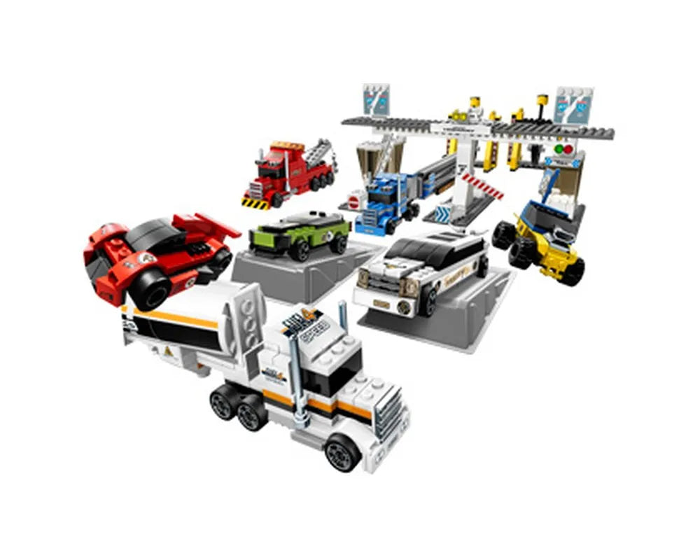 LEGO Racers 8147 Bullet Run set with multiple race cars, trucks, and a pit stop structure on a white background.