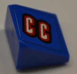 Blue LEGO Slope 30 1x1x2/3 brick with a black-bordered red 'CC' logo on top, from Set 8198.