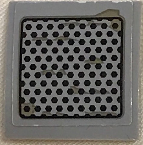 Gray LEGO Slope, Curved 2x2x2/3 with a black perforated plate hexagonal pattern, featuring light scratches.