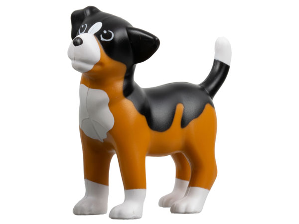A LEGO Sniff dog toy, a puppy with a black back, brown body, and white chest, muzzle, feet, and tail tip.