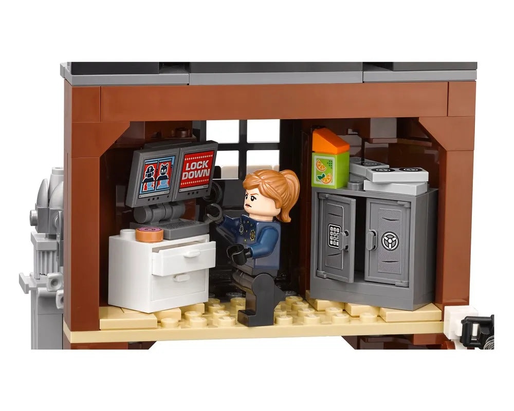 A LEGO minifigure police officer at a computer showing 'LOCK DOWN' in a room with an open safe and snacks.