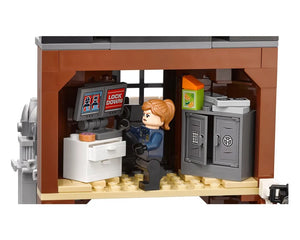 A LEGO minifigure police officer at a computer showing 'LOCK DOWN' in a room with an open safe and snacks.
