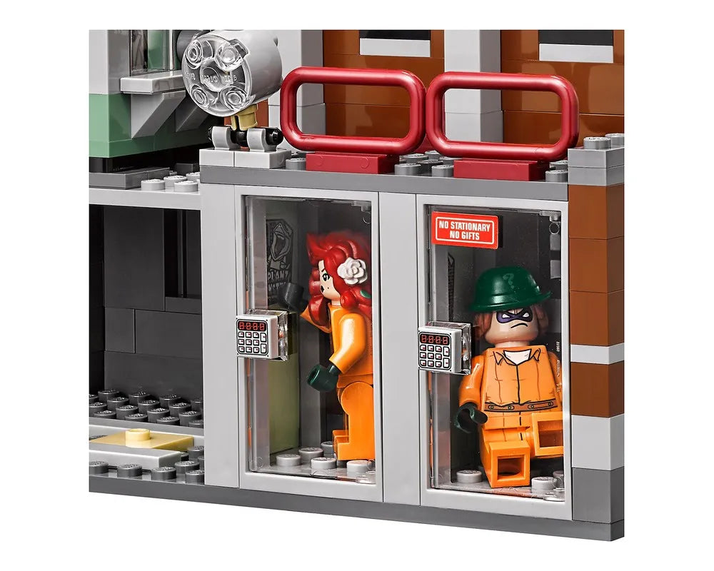 LEGO Arkham Asylum set 70912 with Poison Ivy and Riddler minifigures in prison cells, keypads, and a 'no gifts' sign.