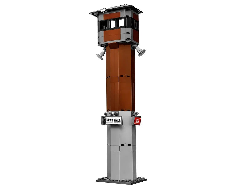 LEGO Super Heroes 70912 Arkham Asylum watchtower, featuring a tall brown and grey structure with loudspeakers and signs.