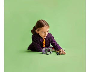 Girl playing with LEGO Super Heroes 76253 Guardians of the Galaxy Headquarters set and minifigures.