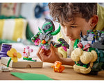 Child playing with LEGO Super Mario Prince Florian and Bowser's Castle sets, with a pink Yoshi and flower.