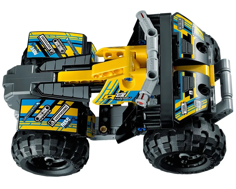 Yellow and grey LEGO Technic 42034 Quad Bike featuring large black tires and blue and yellow graphic stickers.