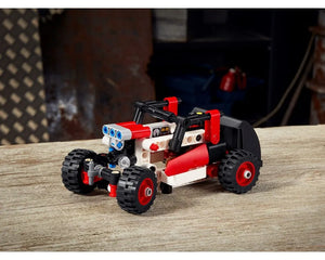 Red and white LEGO Technic 42116 alternate buggy build on a wooden table.