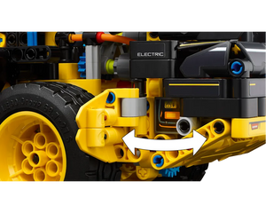 Close-up of LEGO Technic Volvo L120 Electric Wheel Loader, showing the front wheel, yellow chassis, 'ELECTRIC' label, and articulation arrows.