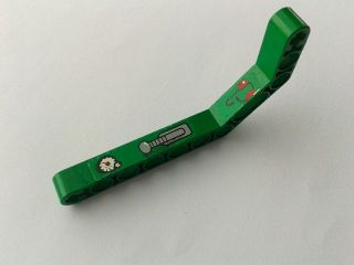 Green LEGO Technic bent liftarm 1x11.5 with gauge, lever, and headphones pattern, part 32009pb023L from set 8217.