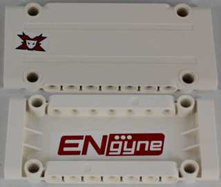 Two white LEGO Technic panel plates with a red and black Team Extreme skull logo and a red 'ENgyne' text.