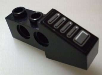 Black LEGO Technic Slope 4x1x1 2/3 with dark gray tread plate sticker. Part 2743pb01 from set 8215.