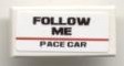 White LEGO 1x2 tile with a 'FOLLOW ME PACE CAR' sticker, featuring black text and a red horizontal line.