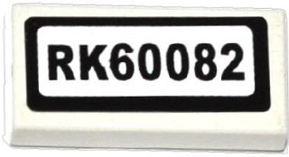 White LEGO 1x2 tile with a sticker displaying 'RK60082' in black text, framed by a black border.