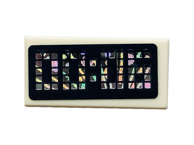 Close-up of an off-white LEGO 1x2 tile with a black display showing '00:06' in colorful, pixelated digits.