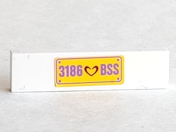 White LEGO 1x4 tile with a yellow sticker featuring a dark red heart and medium lavender '3186 BSS' text.