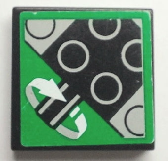 A black LEGO 2x2 tile with a green sticker featuring a black and white diagonal pattern of circles and a white rotation sensor icon.