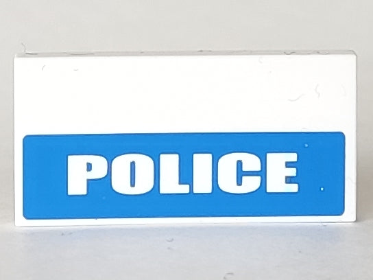 White LEGO 2x4 tile with 'POLICE' in white on a blue background, covering the bottom half of the tile.