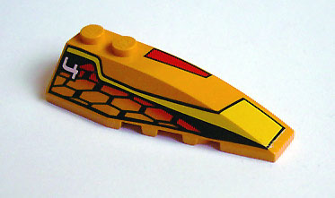 Yellow LEGO Wedge 6 x 2 Right brick with black, red, and orange hexagonal pattern and white number 4 print.
