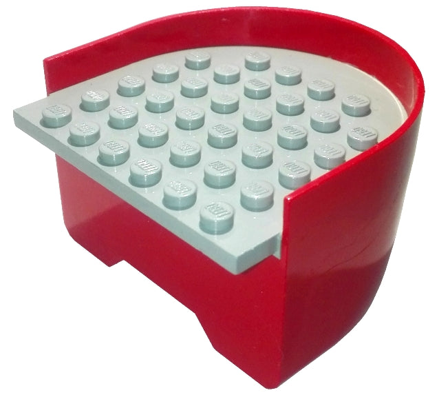 Red LEGO boat hull with a smooth stern, featuring a light gray deck with studs. Part x147c01.